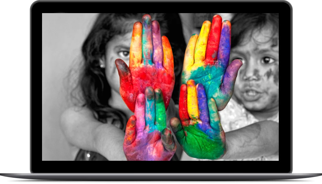 Laptop_multicultural_advertising a group of children with painted hands
